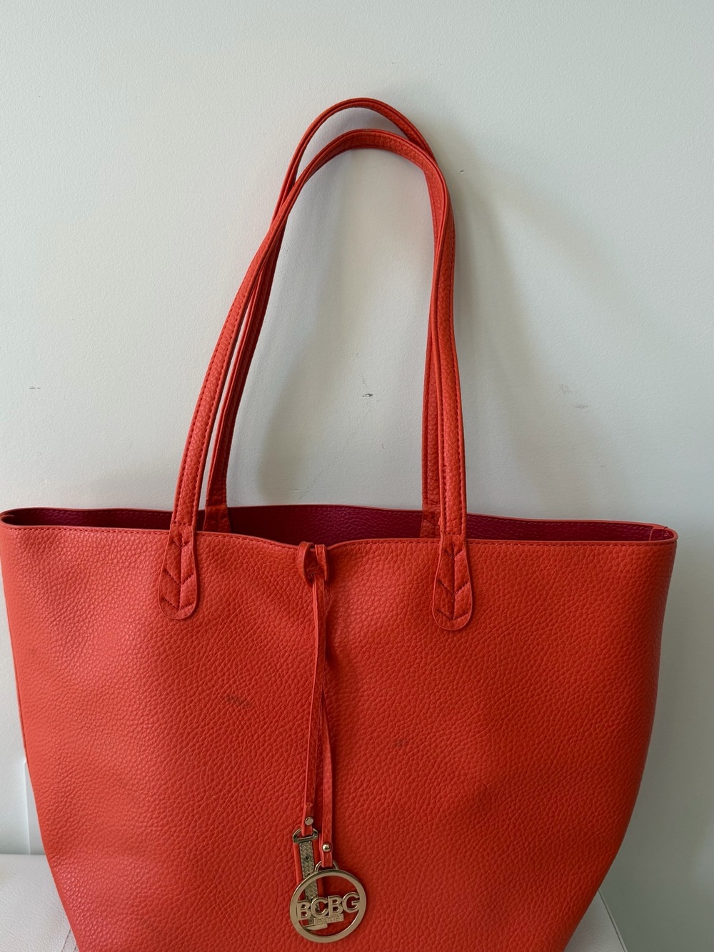 BCBG Orange-Red Pebbled Leather Tote with Logo Charm